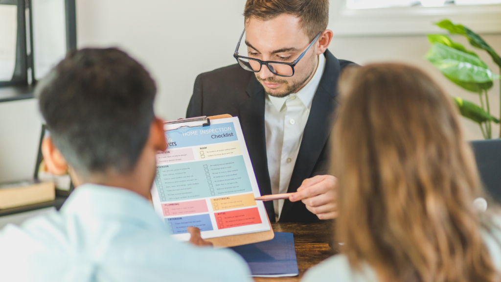 Tax professional explaining home inspection checklist to homeowners