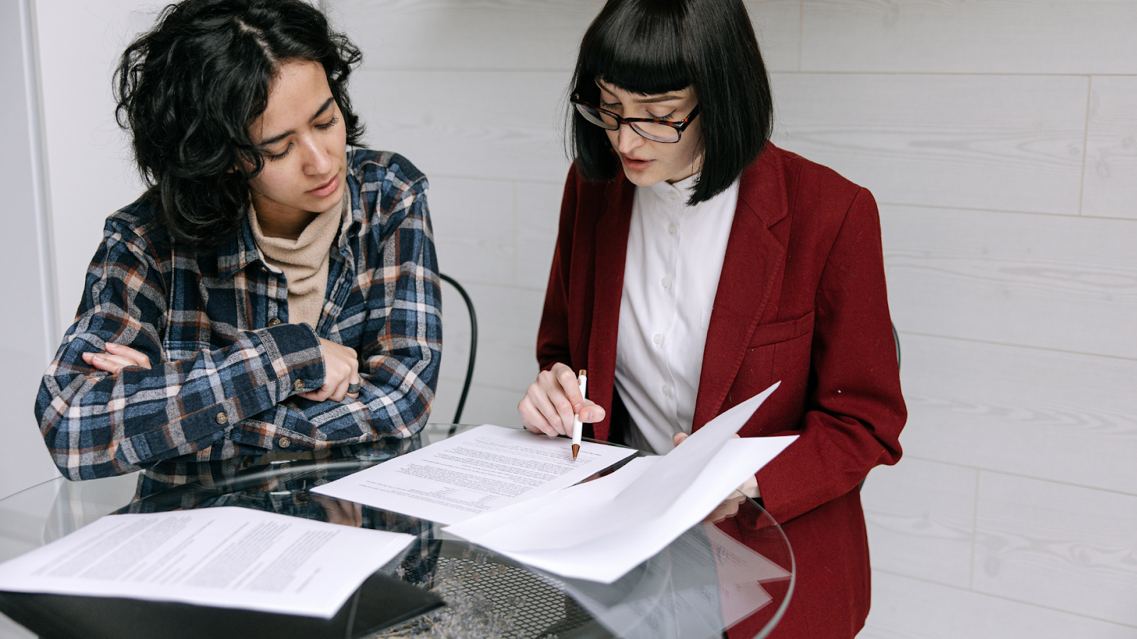 Tax adviser with client gathering necessary files before filing property tax appeal