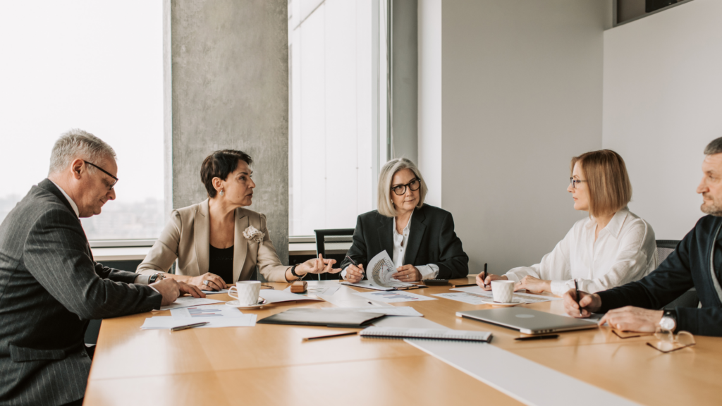 A board panel reviewing documents during a property tax hearing