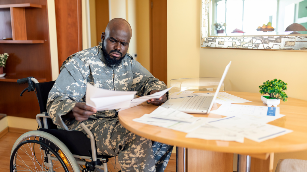A disabled veteran in uniform reviewing property tax exemption documents