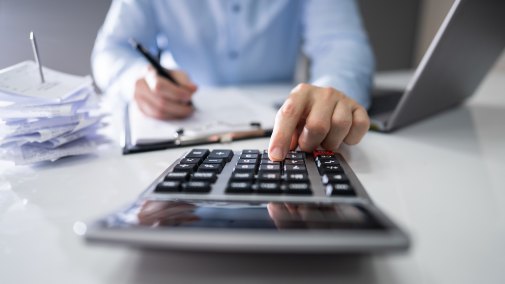 Accountant calculating commercial property tax rate in Chicago office