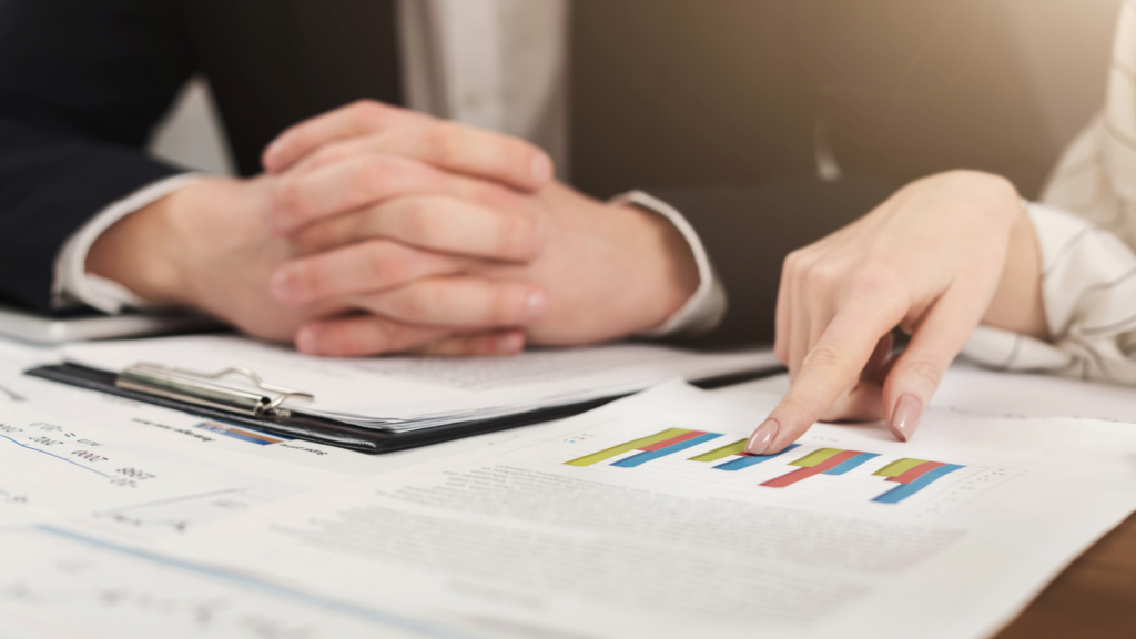 Advisor reviewing property assessment charts to identify overvalued Illinois home