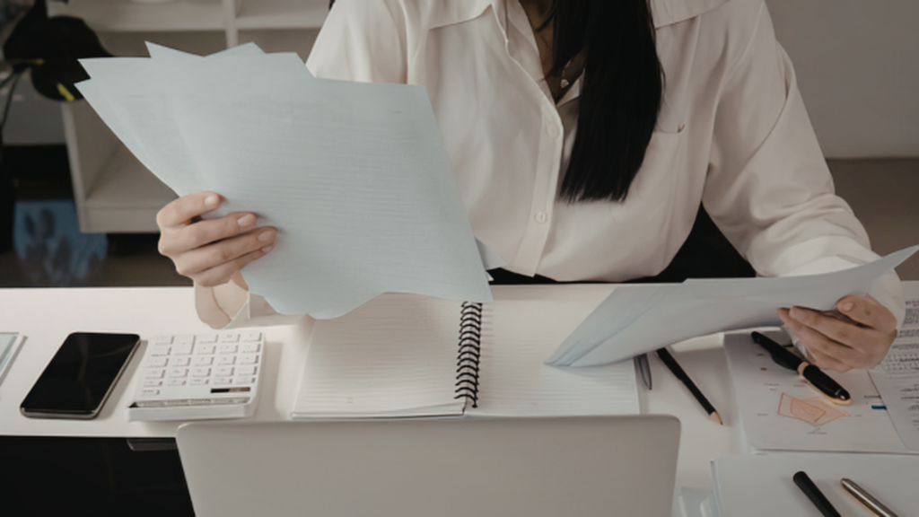 Homeowner sorting through documents to support a tax appeal case