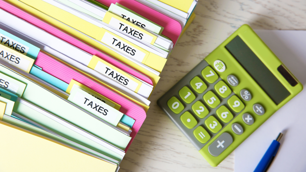 Organized tax folders and calculator representing documented property tax evidence