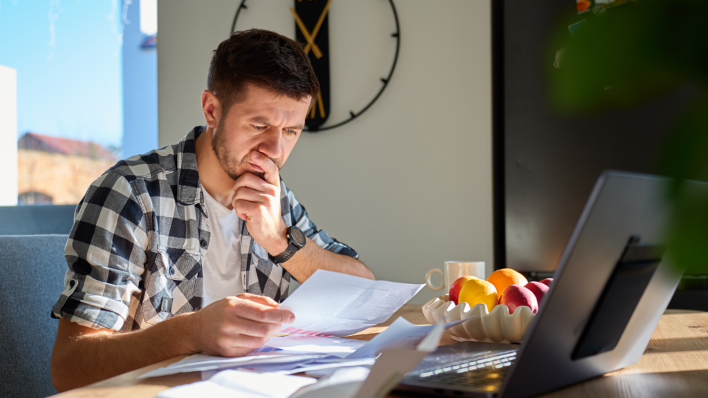 Concerned homeowner reading about Illinois property tax delinquency consequences