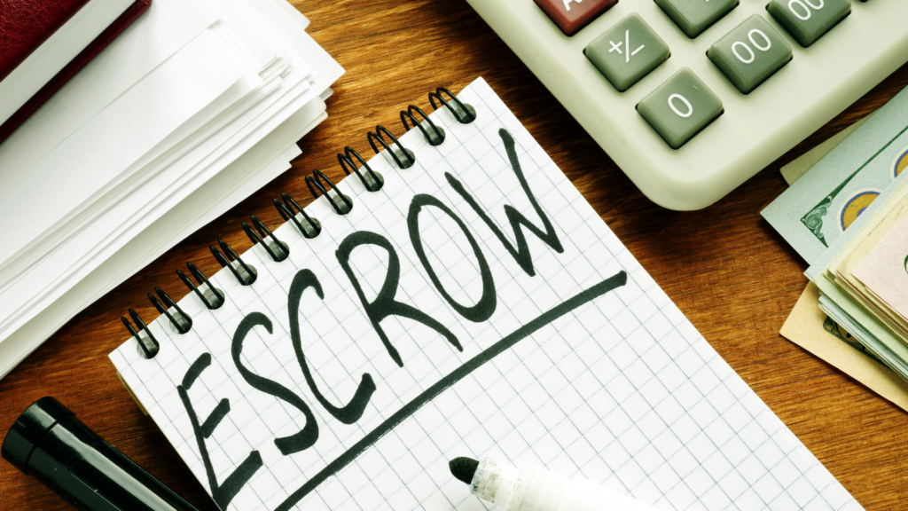 Escrow notebook with calculator showing property tax payment breakdown