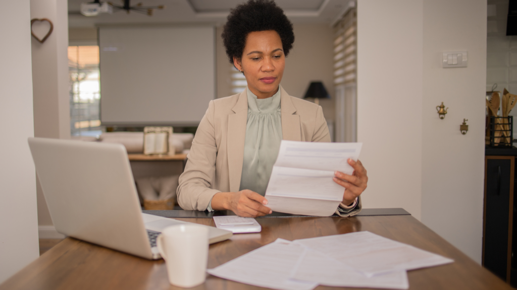 Homeowner studying property tax paperwork before annual income tax filing
