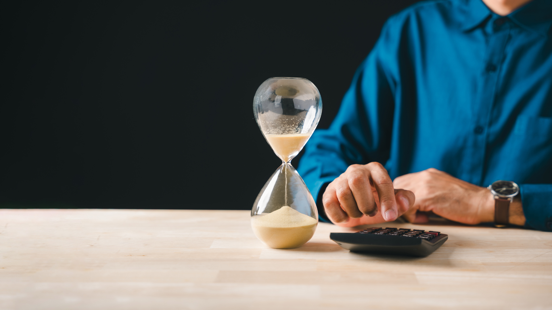Hourglass and calculator representing Illinois property tax protest deadline urgency