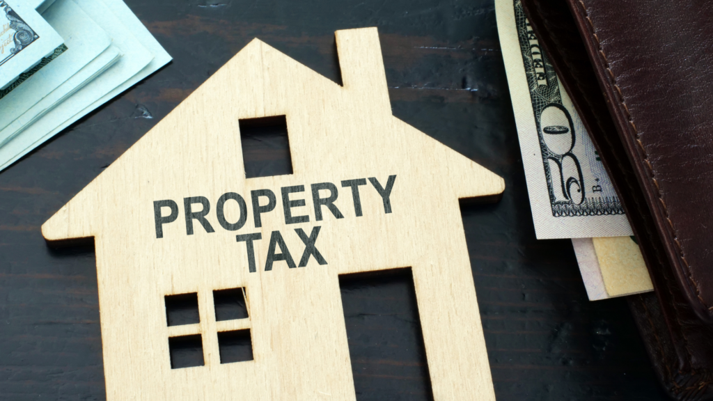 House model and money representing how Illinois property tax exemptions work