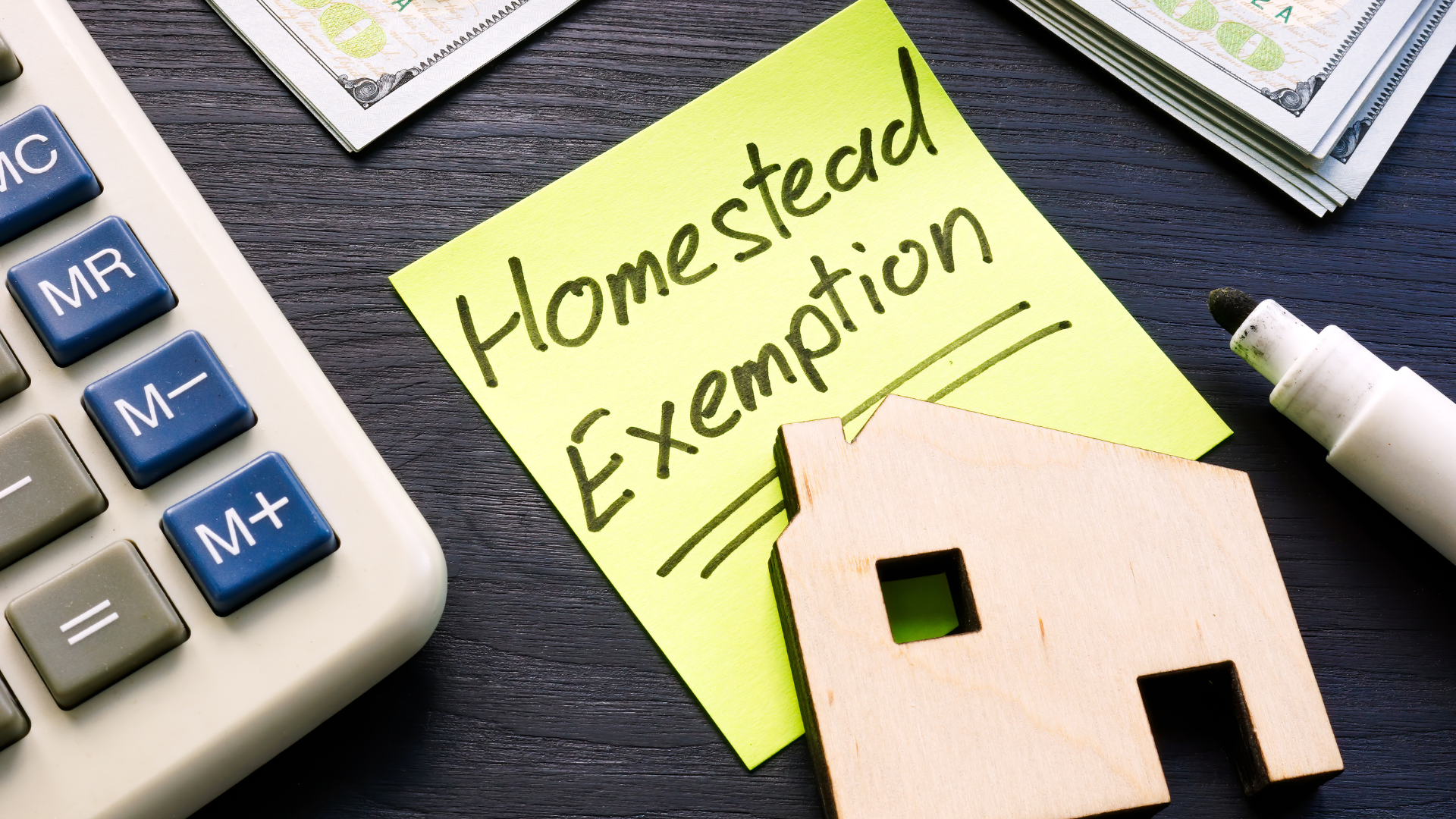 Illinois homestead exemption concept with calculator and miniature house model