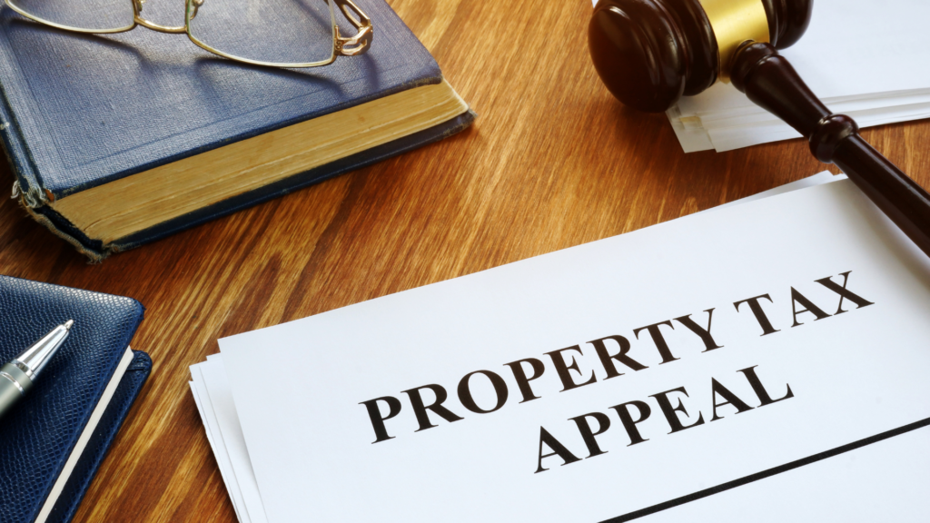 Property tax appeal filing concept with gavel book and legal documents