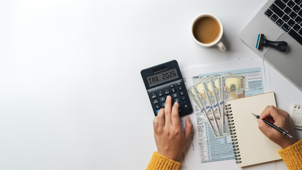 Homeowner calculating property tax obligations with cash and tax forms