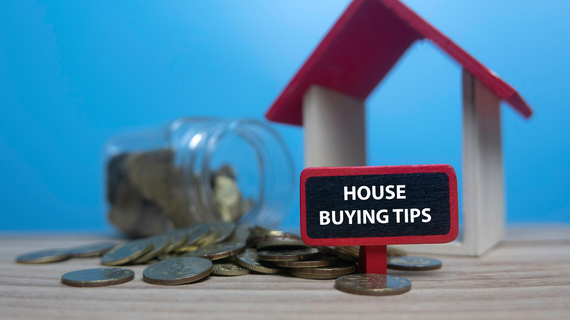House buying tips sign with coins representing property tax savings