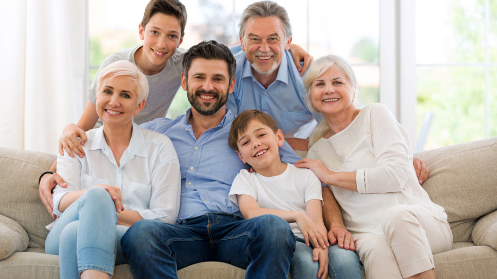 Multi-generational family sitting together representing inherited wealth and property planning
