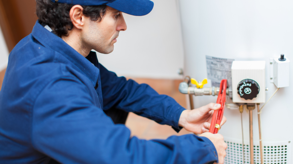 Professional plumber inspecting and repairing residential water heater system