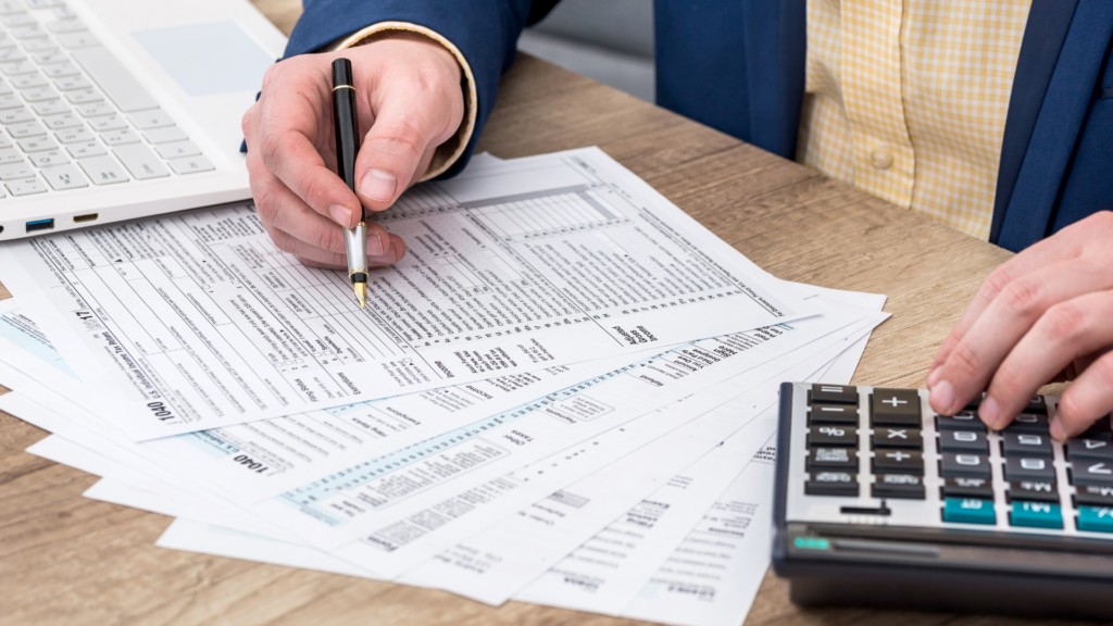 Tax documents and calculator used to break down property tax calculations